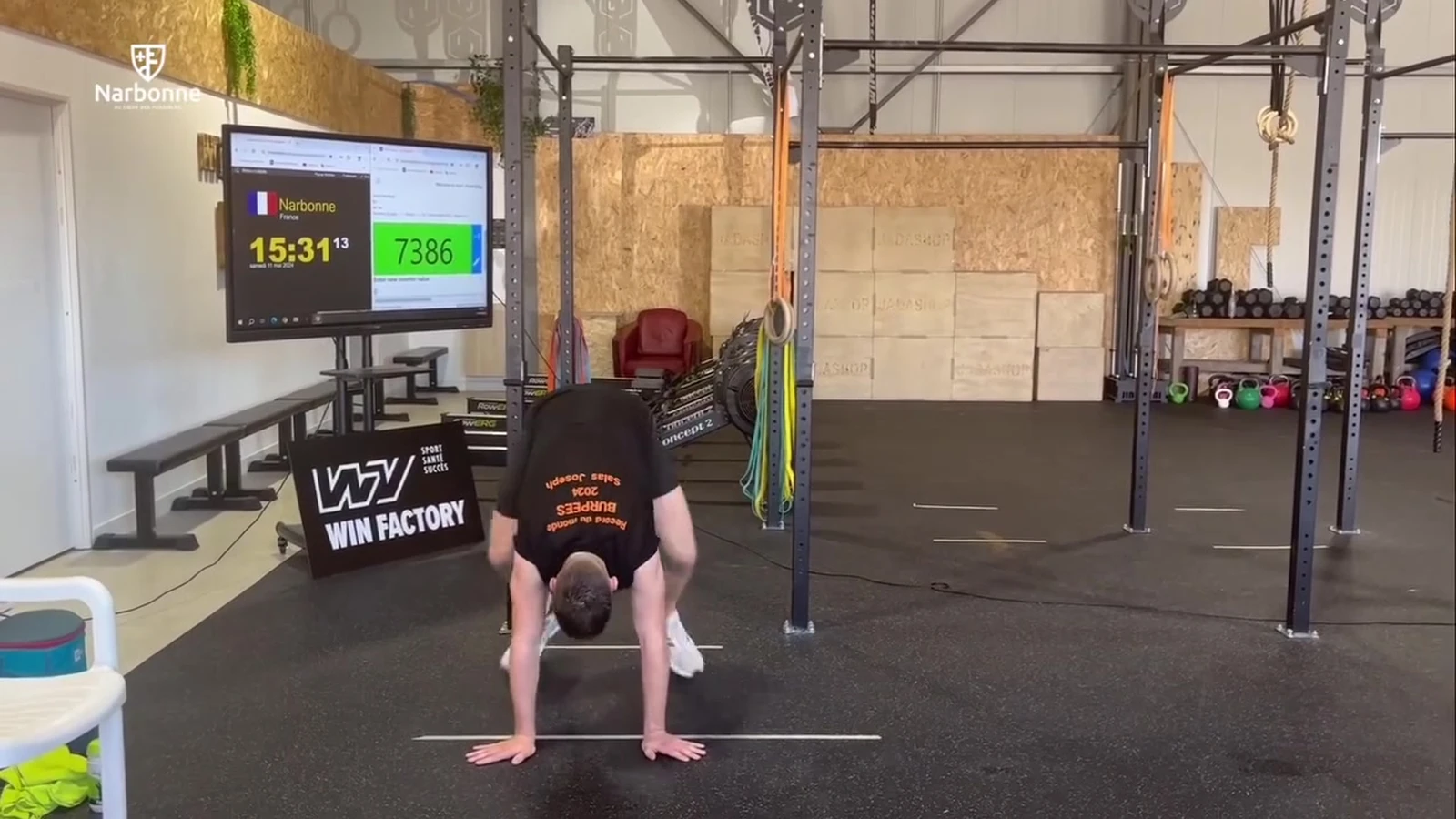 Joseph Salas plants his hands on the gym floor during his 12-hour, 8,523-burpee world-record effort in Narbonne, France.