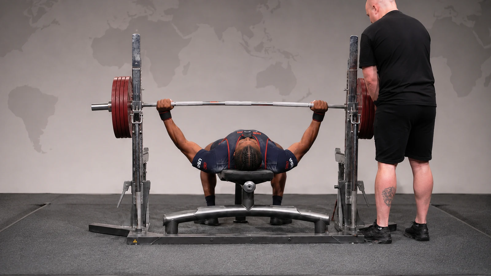 Devin Williams completing a raw bench-press attempt on an IPF platform.