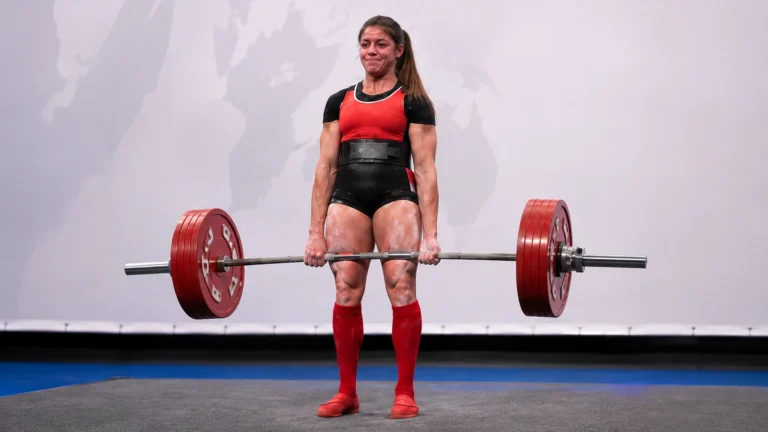 Illustrative recreation of Jessica Buettner locking out a competition deadlift in the 76-kilogram class