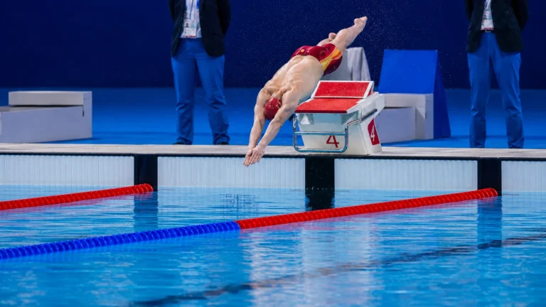 Editorial reconstruction of Pan Zhanle diving from the starting block before his Paris 2024 100-meter freestyle world-record swim.